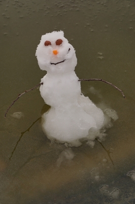 Snowman And Melting Ice
