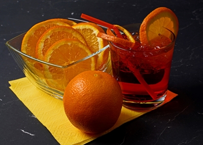 Red cocktail with orange