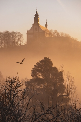 Monastery at sunrise and fog