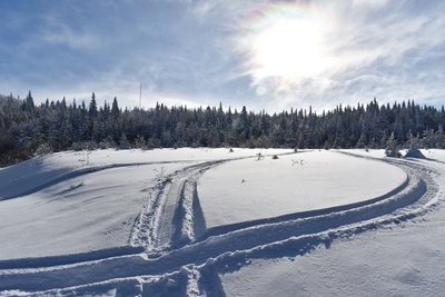 A snowmobile trail in a field