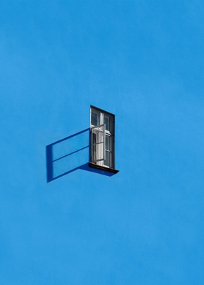An Open Window on Blue Wall