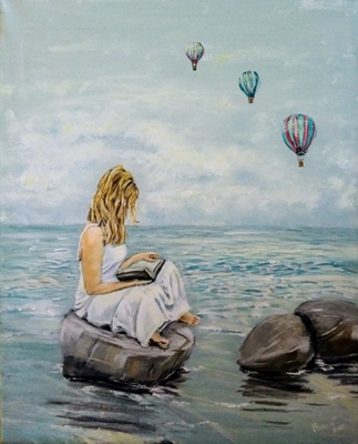 Girl reading on the beach.