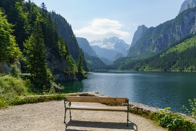 bench at a lake in the alps