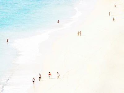 Bright sandy beach with people
