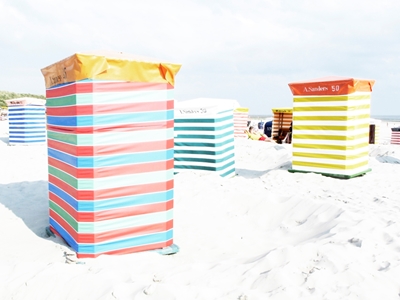 Several colorful beach chairs 