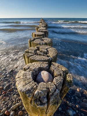 Groyne with waves in the sea
