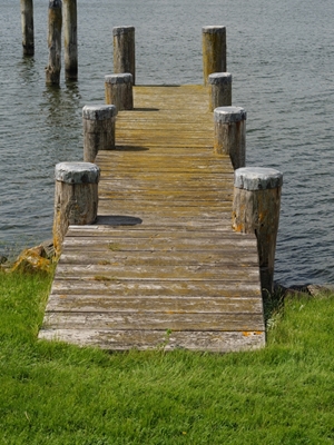 wooden pier at a river 