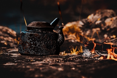 Old kettle by the campfire