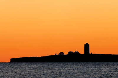 Old lighthouse during sunrise