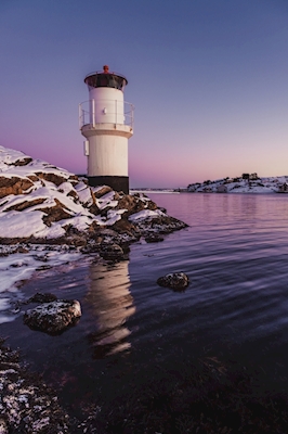 Lighthouse in wintershroud