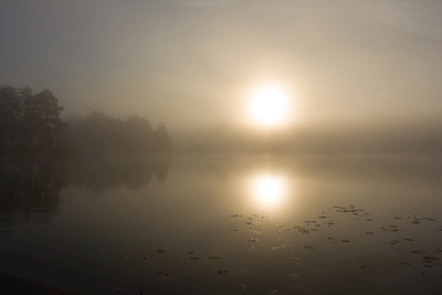 Sunrise at the misty lake