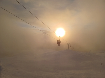Gondolas in fog and sun