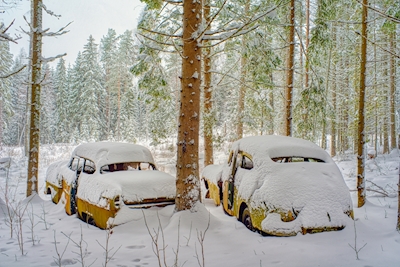 Snow covered Volvo and Opel
