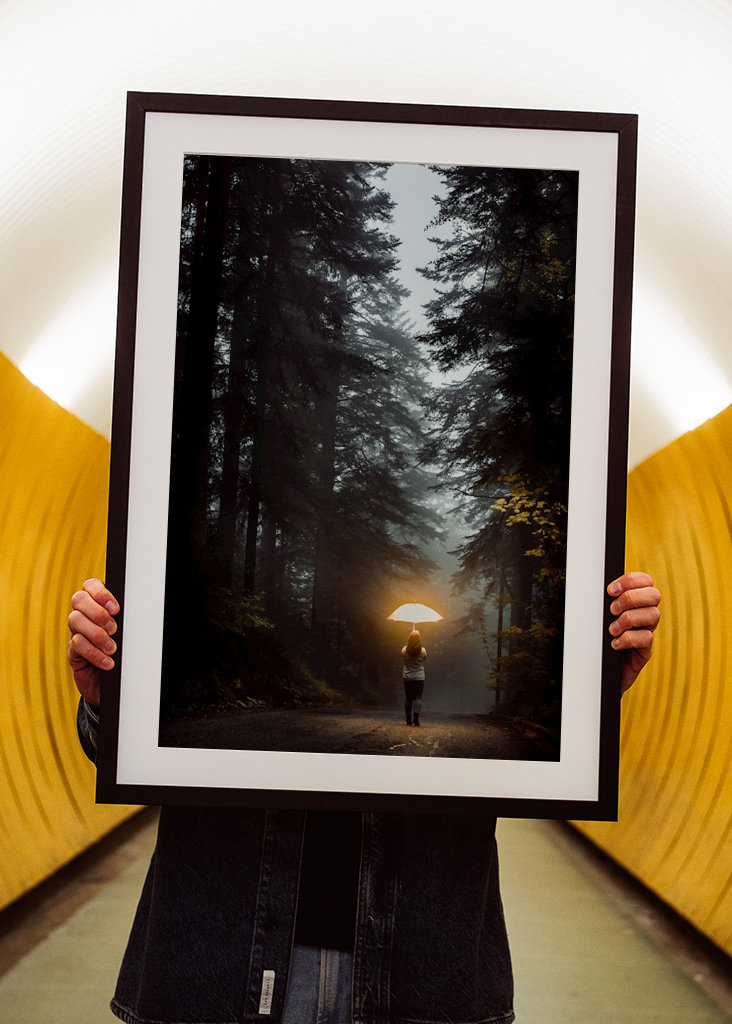 Girl with umbrella in forest