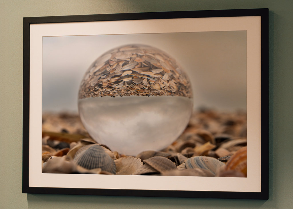 Glass ball in a pile of shells