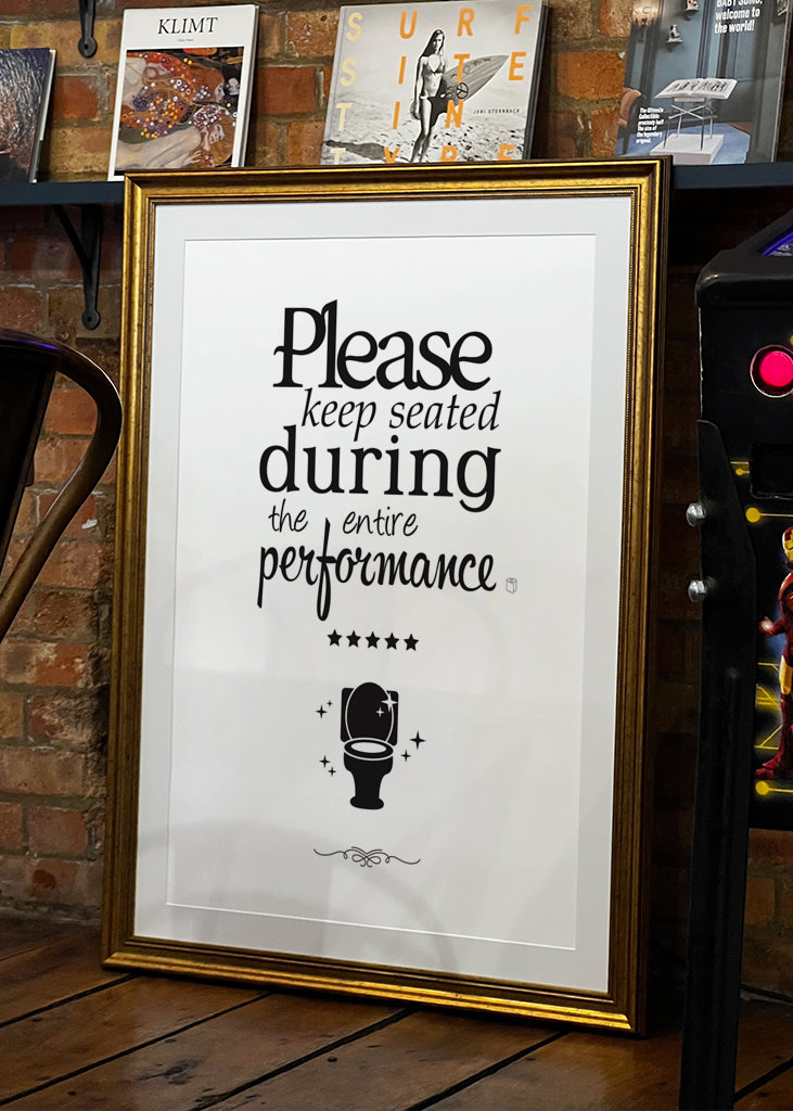 Keep seated - Bathroom sign