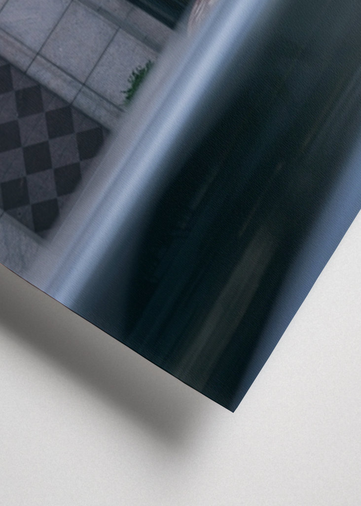 Car passes statue in Boston