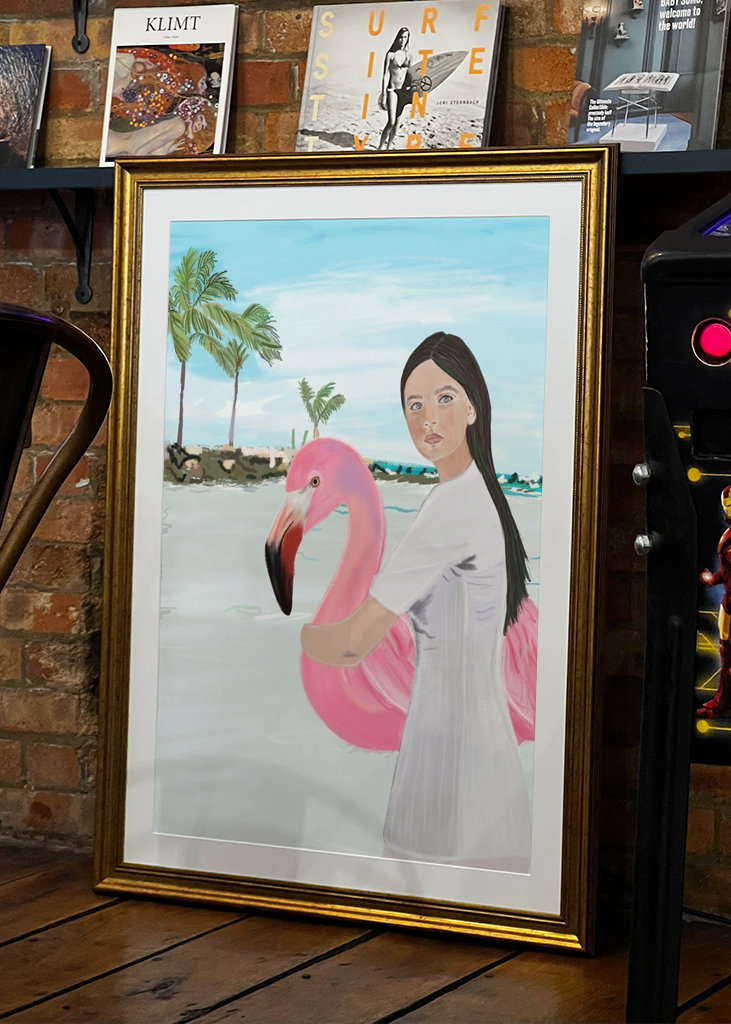 Flamingo und Mädchen am Strand von Aruba