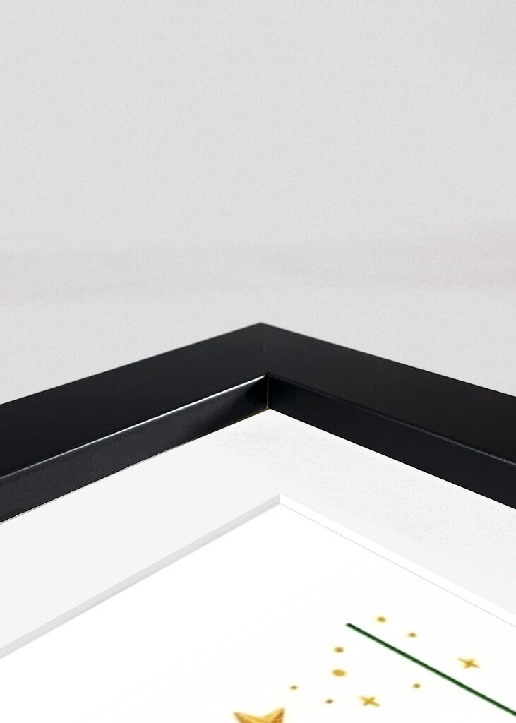 Chat noir sur le sapin de Noël