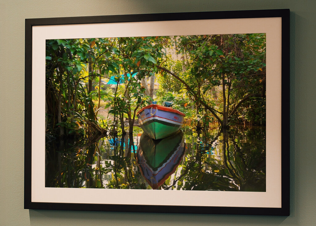 SOLITARY BOAT IN A LUSH HAVEN