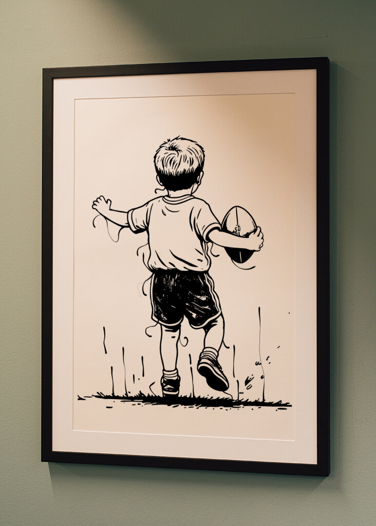 little boy holding rugby ball