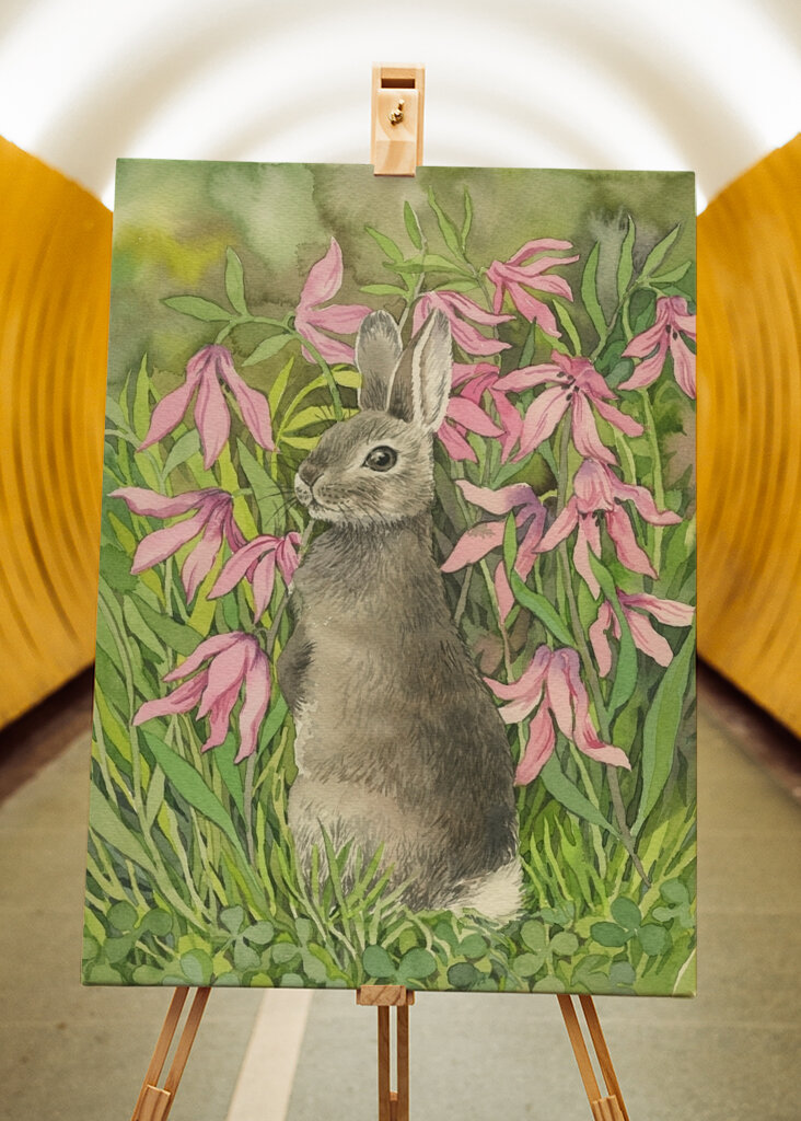 Rabbit among flowers and clove