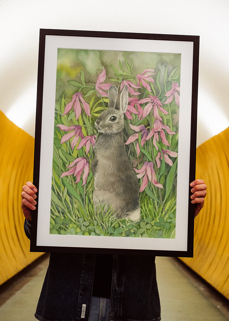 Rabbit among flowers and clove