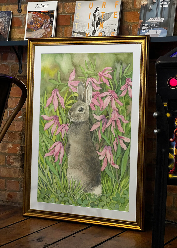 Rabbit among flowers and clove