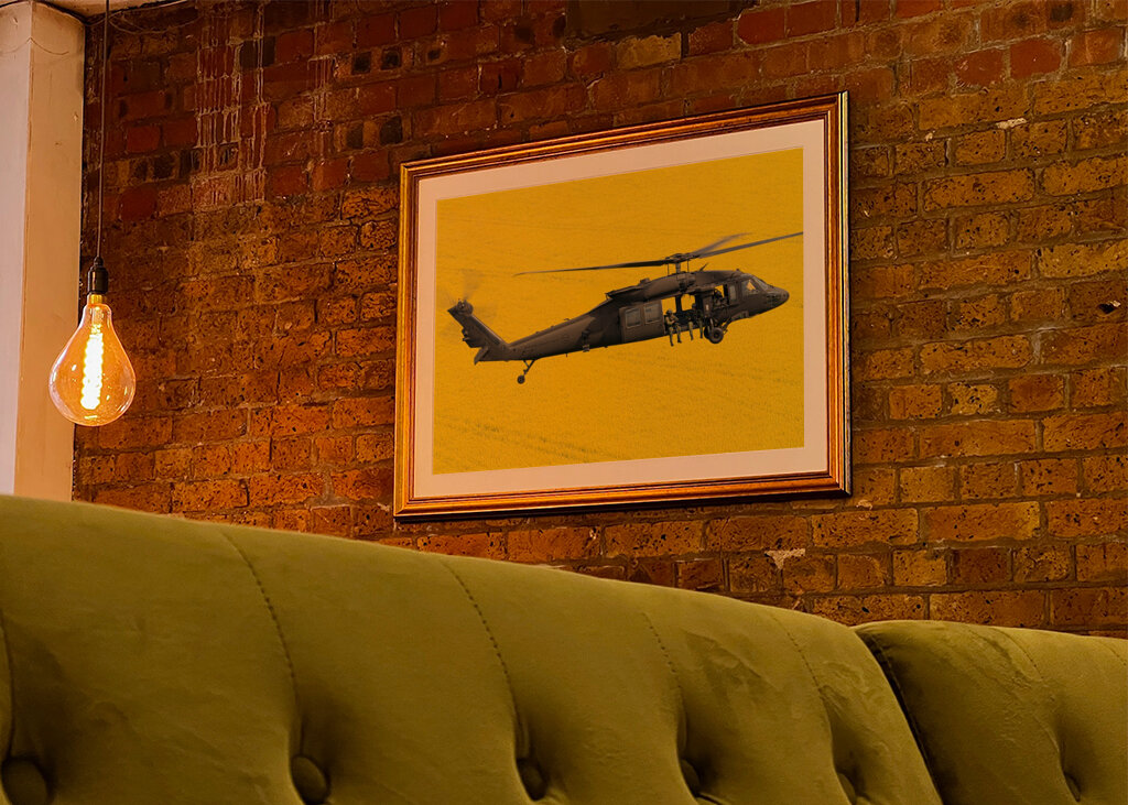 Blackhawk over fields of gold