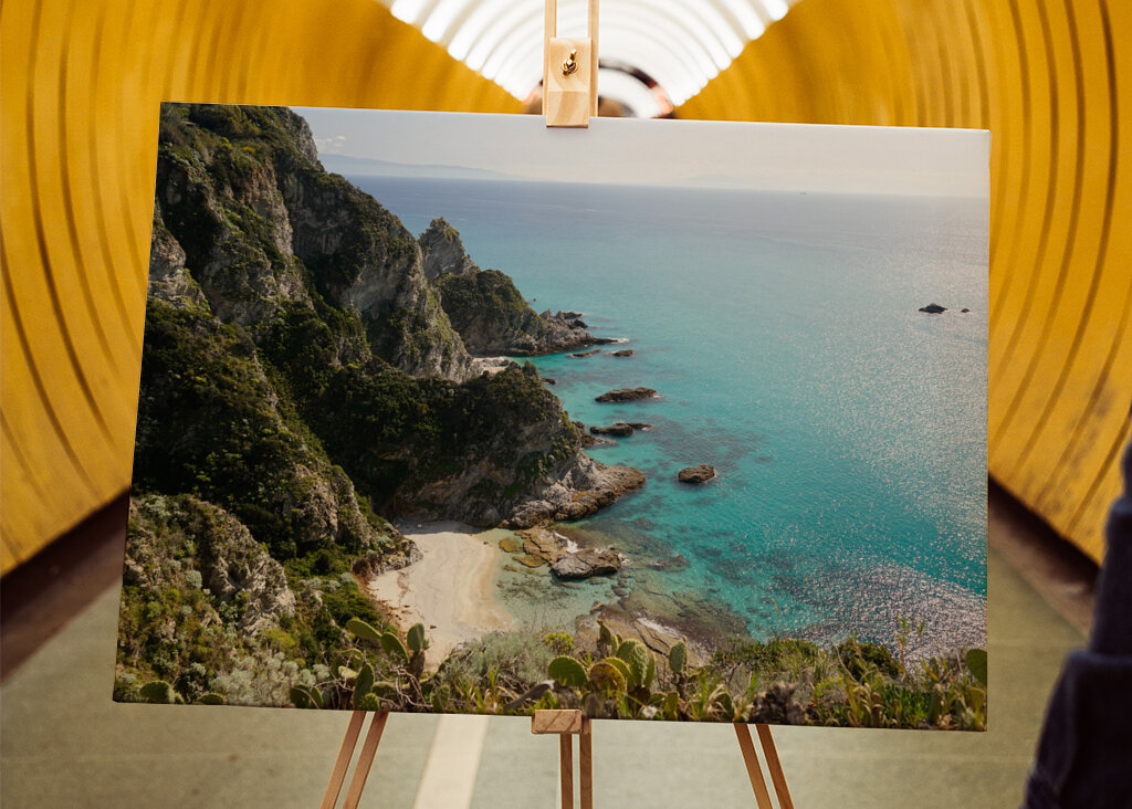 Rocks meet the turquoise sea
