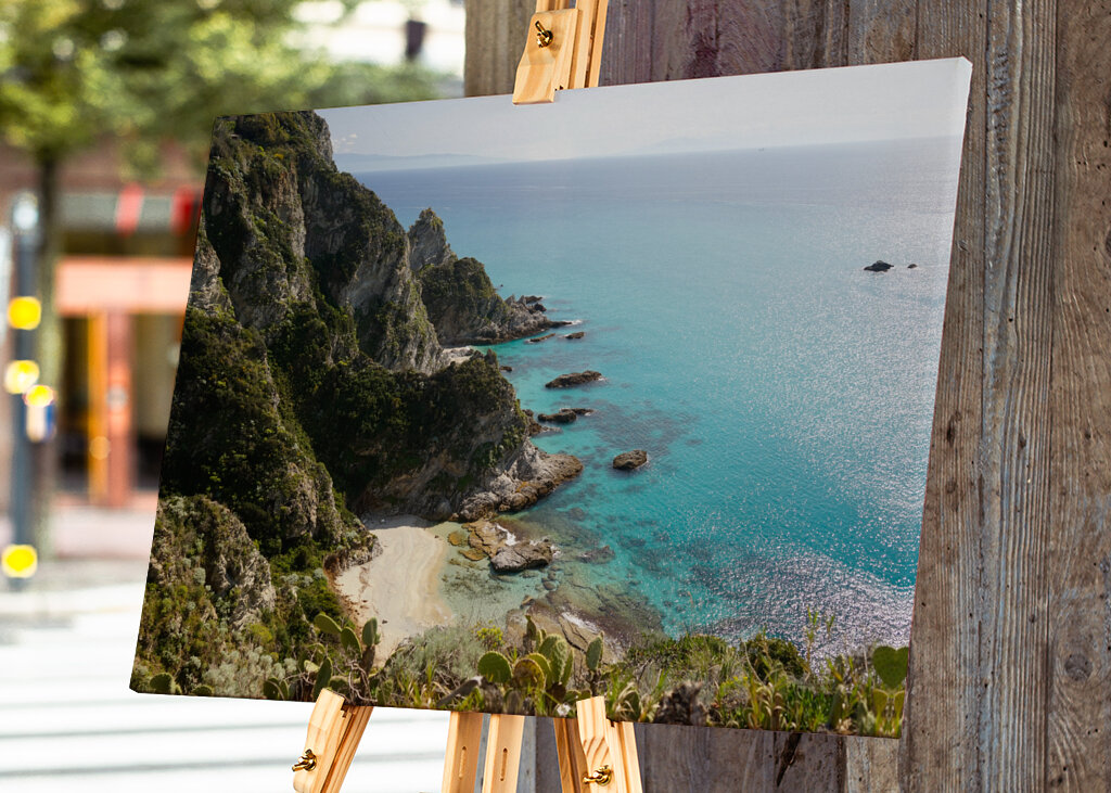 Rocks meet the turquoise sea