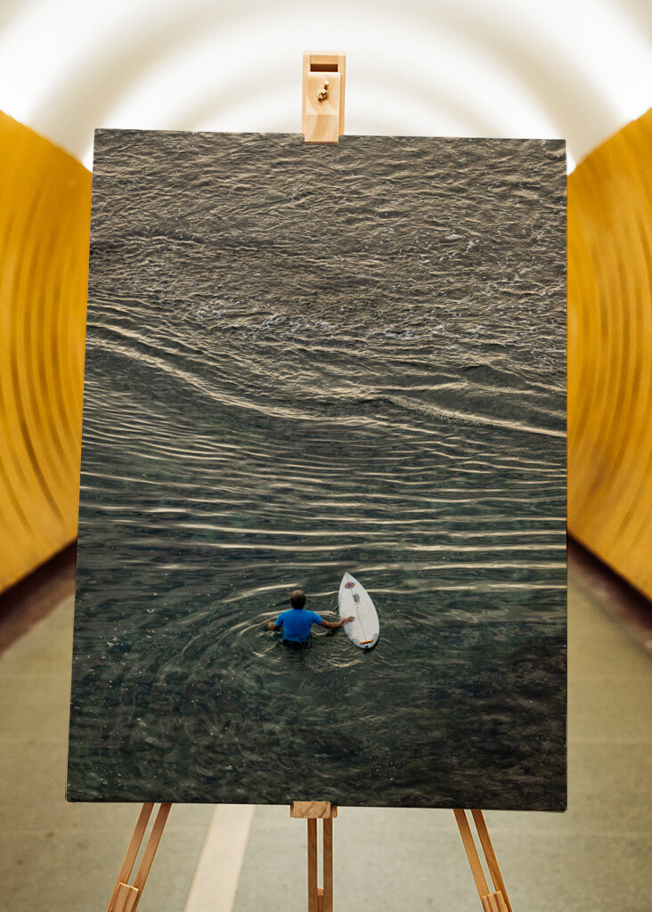 Surfer walking over the reef