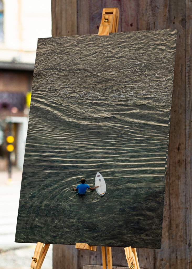 Surfer walking over the reef