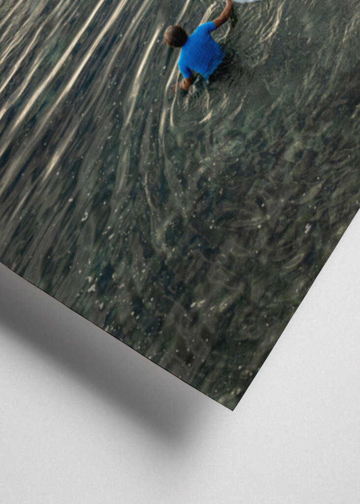 Surfer walking over the reef