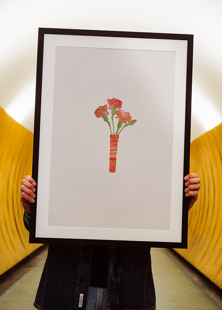 Red Carnations In Red Vase