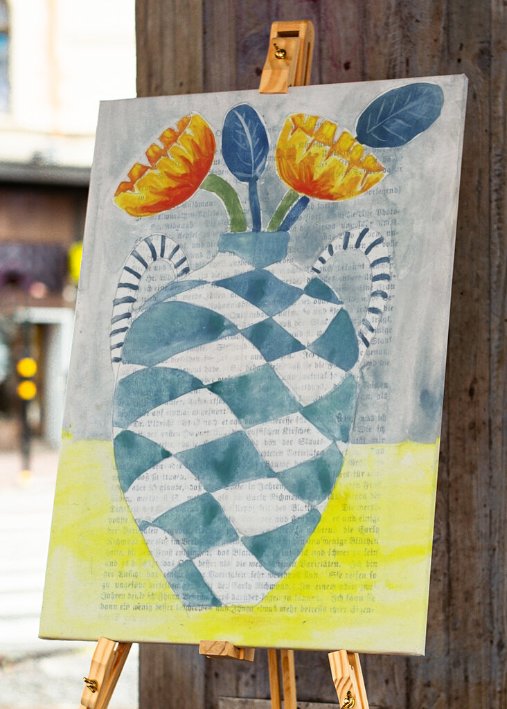 Checkered Vase With Orange Flowers