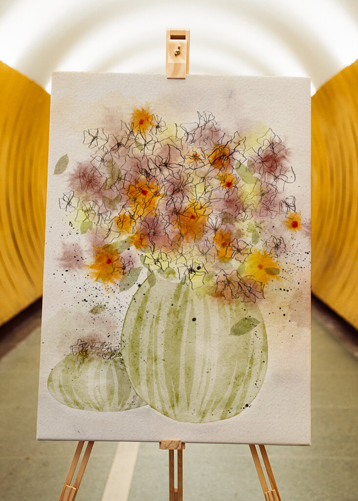 Orange and Yellow Flowers in a Striped Vase