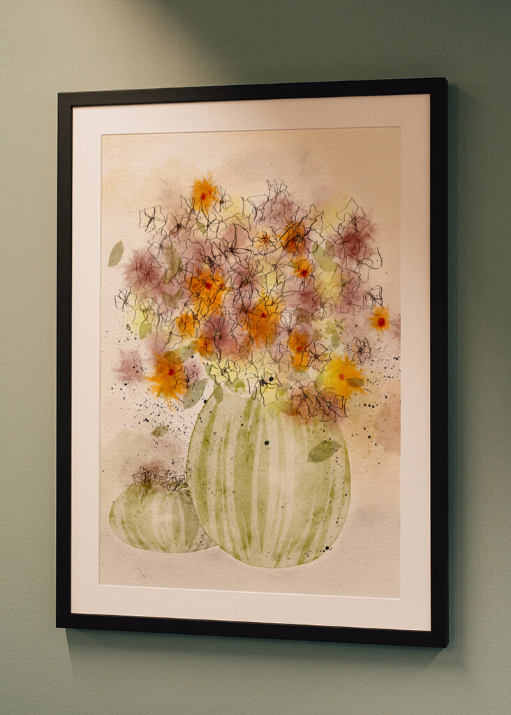 Orange and Yellow Flowers in a Striped Vase