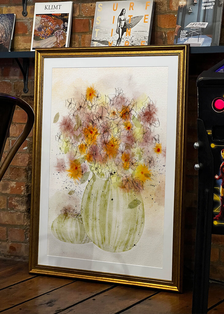 Orange and Yellow Flowers in a Striped Vase