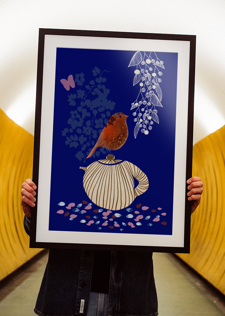 Red Bird Perched on a Striped Teapot