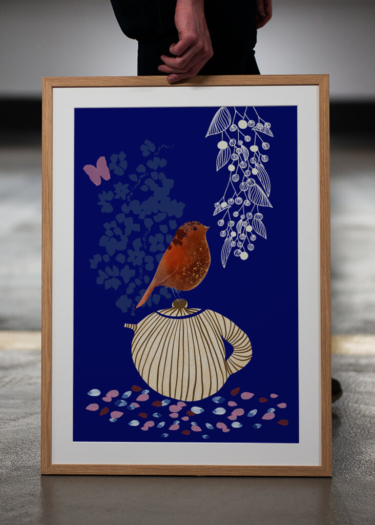 Red Bird Perched on a Striped Teapot