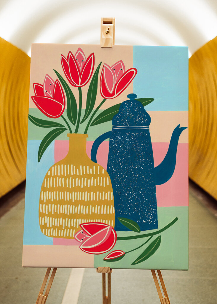 Vibrant Red Tulips In A Decorative Vase