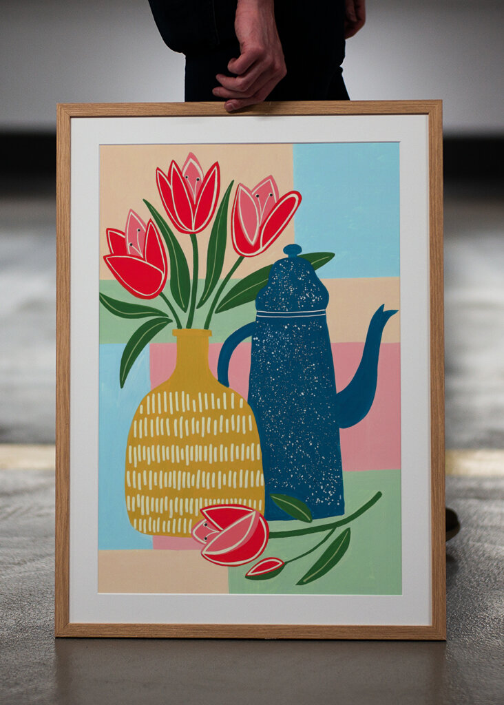 Vibrant Red Tulips In A Decorative Vase