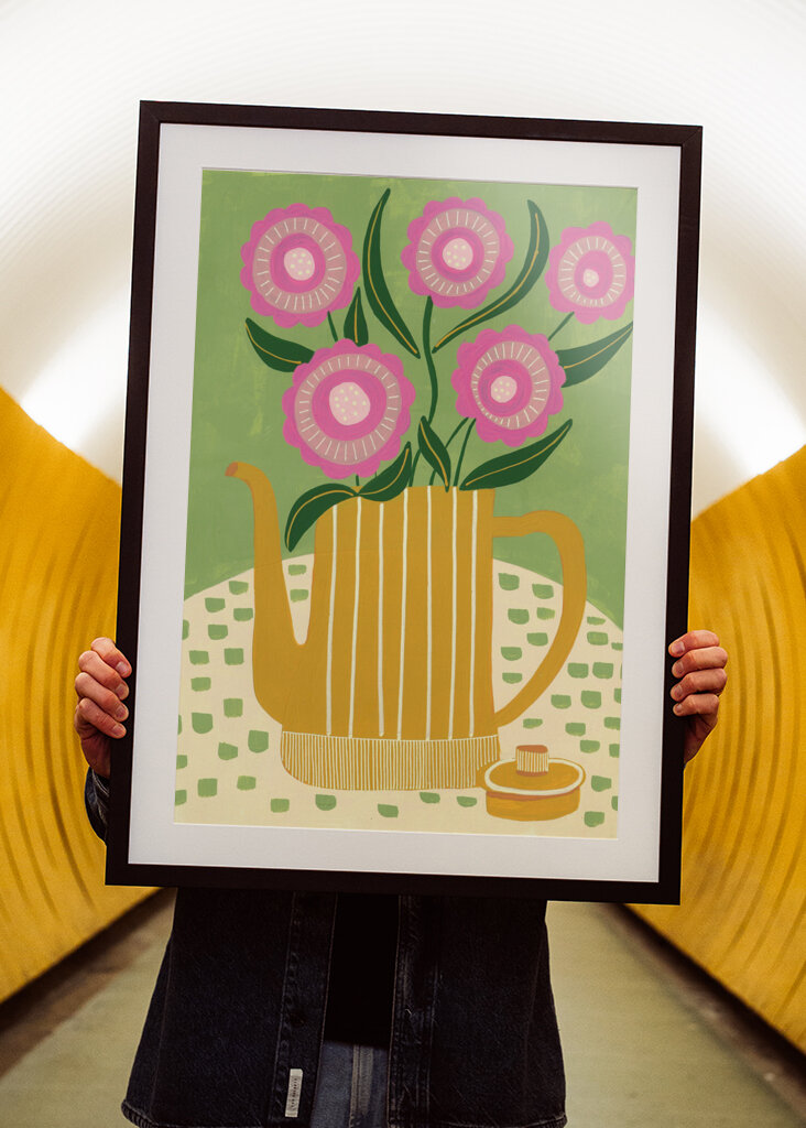 Pink Flowers In A Striped Yellow Teapot