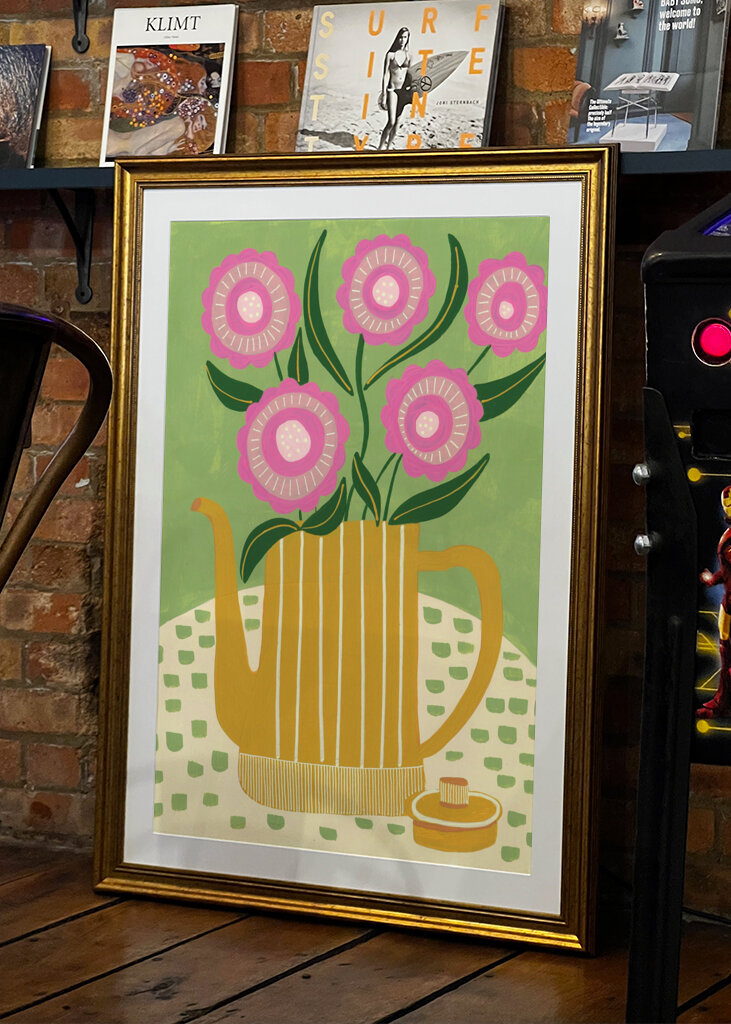 Pink Flowers In A Striped Yellow Teapot