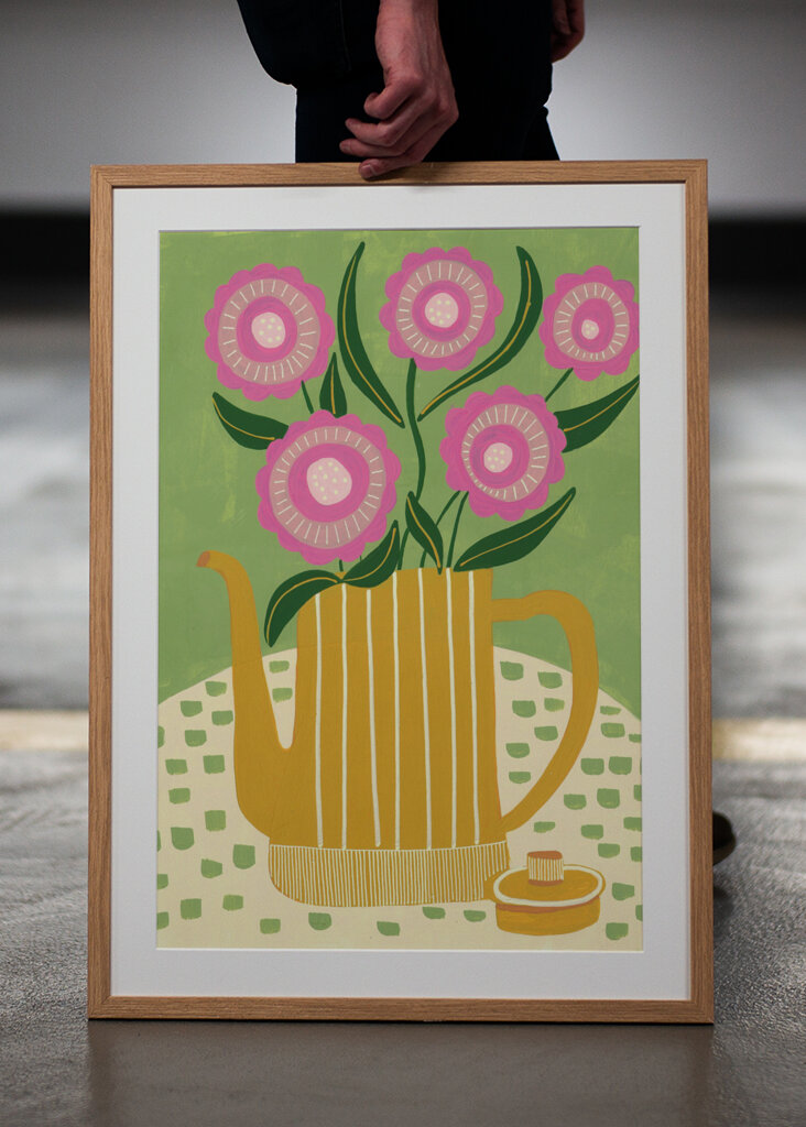 Pink Flowers In A Striped Yellow Teapot