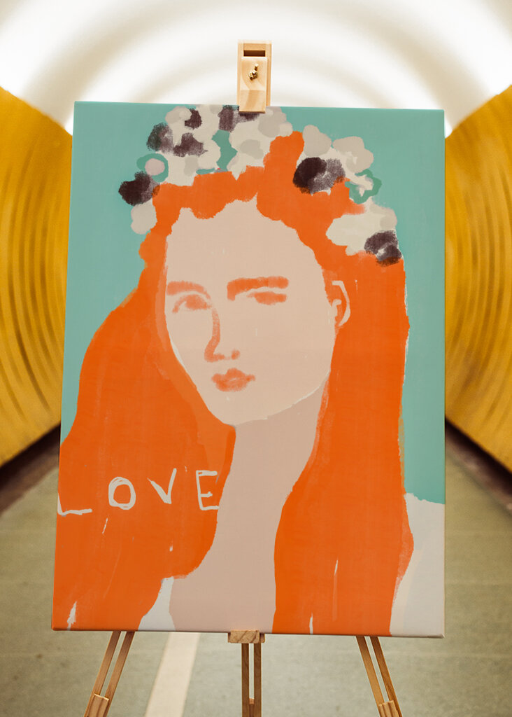 Woman with Orange Hair Adorned with Flowers