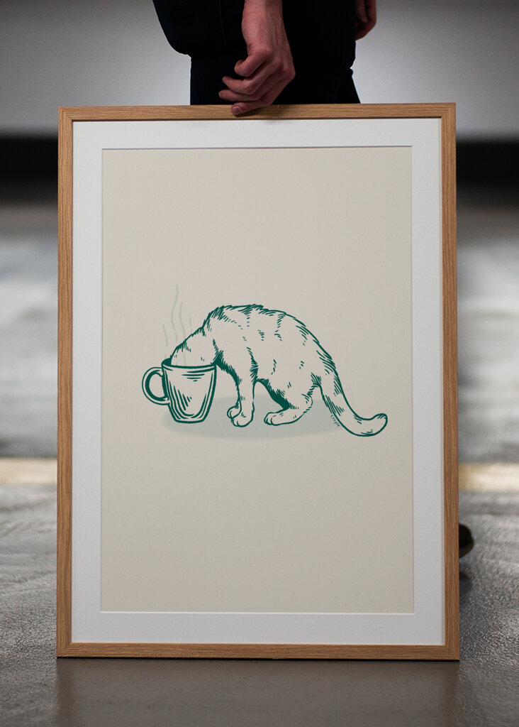 Gato do café no verde