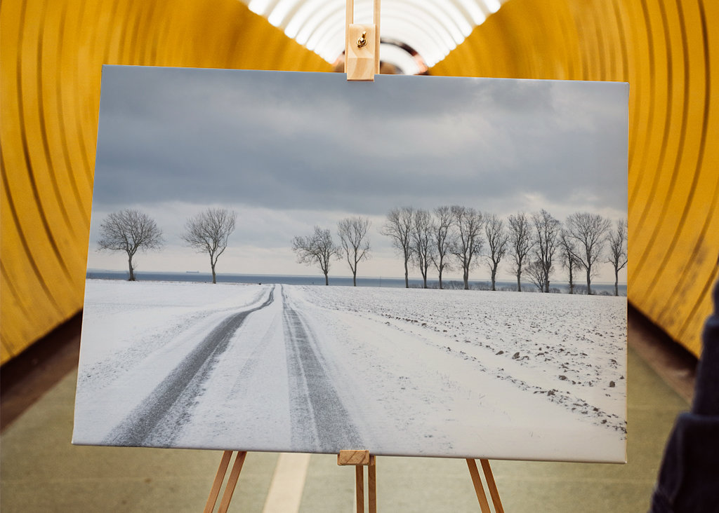 Snowy road towards the sea