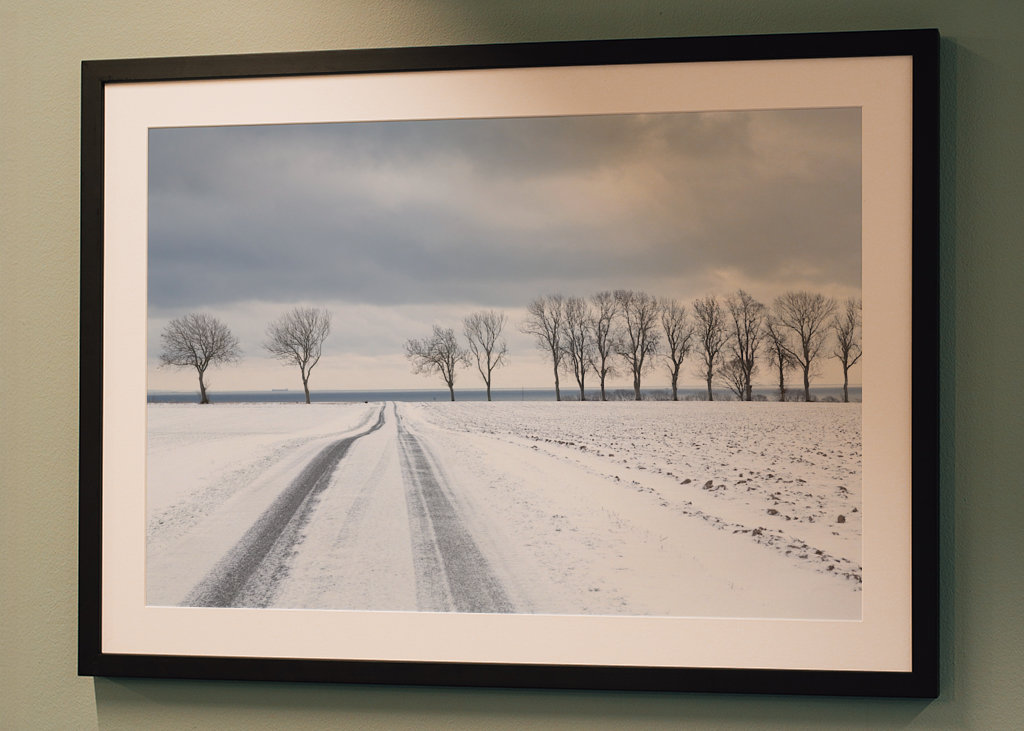 Snowy road towards the sea
